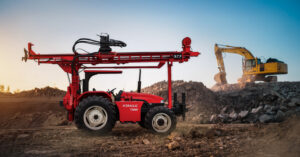 Tractor-mounted drilling rig